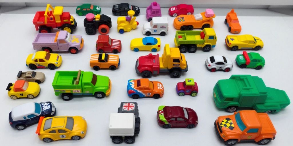 Colorful car toys on a bright surface.