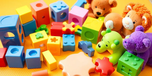 Colorful educational toys for 2-year-olds on a play mat.