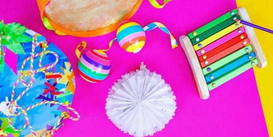 Colorful DIY musical instruments for kids on a table.